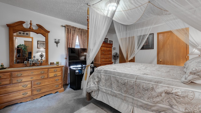 carpeted bedroom with a textured ceiling