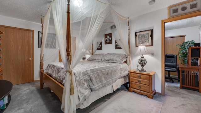 bedroom with a closet, carpet, and a textured ceiling