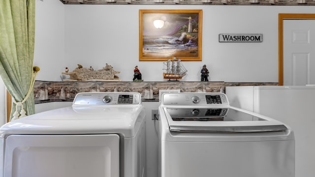 washroom with independent washer and dryer