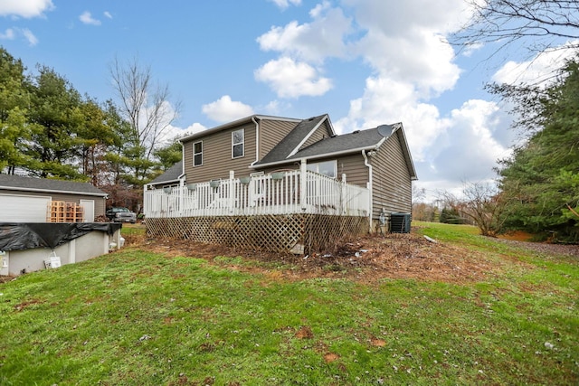 back of house with a yard, a deck, and cooling unit