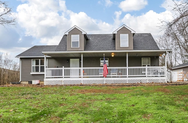 view of front of house with a porch and a front yard