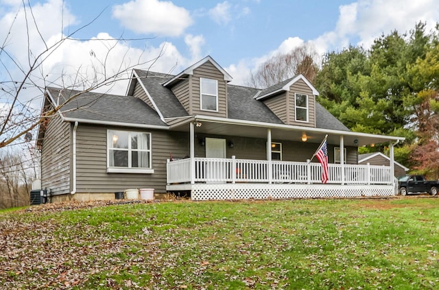 cape cod-style house with central air condition unit, a porch, and a front yard