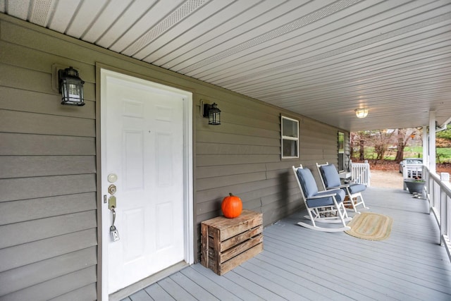 wooden terrace with a porch