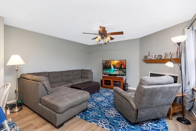 living room featuring hardwood / wood-style flooring and ceiling fan