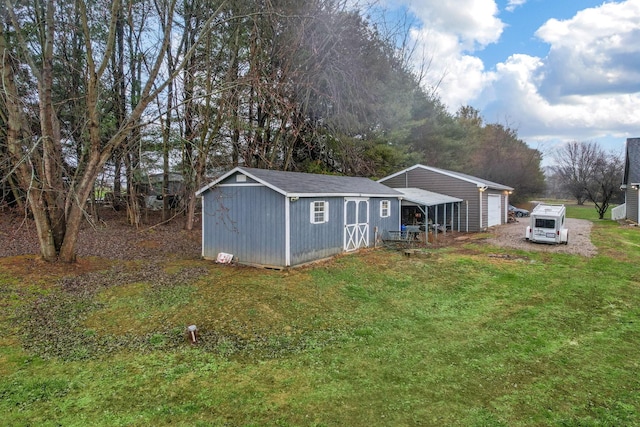 exterior space featuring an outbuilding and a front yard