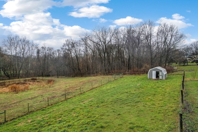 view of yard featuring a storage unit and a rural view