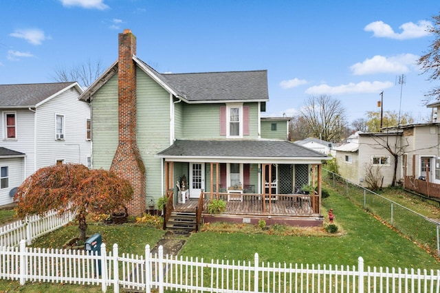 view of front of property featuring covered porch and a front yard