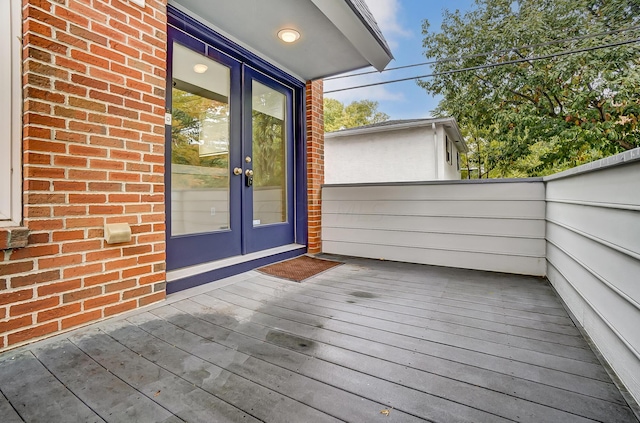 wooden deck featuring french doors