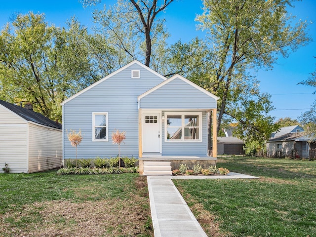 bungalow with a front yard