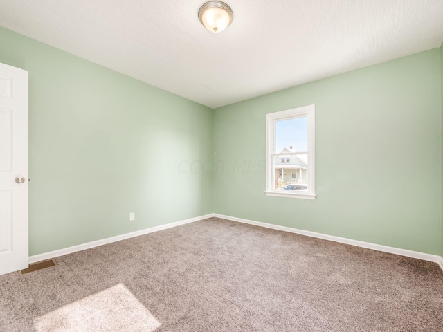 view of carpeted spare room