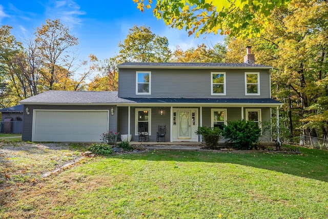 view of front property with a garage and a front lawn