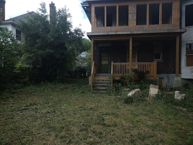 back of house with a porch