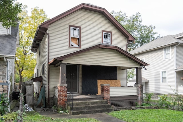 front of property featuring a porch and central air condition unit