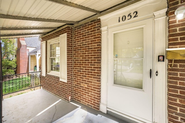 doorway to property with a porch