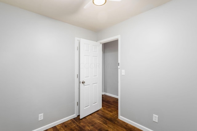 unfurnished room featuring dark hardwood / wood-style flooring