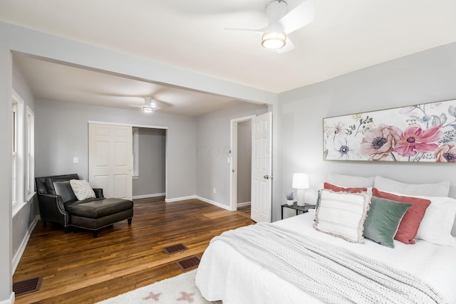 bedroom with ceiling fan, a closet, and dark hardwood / wood-style floors