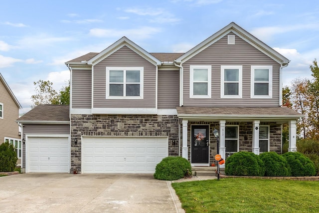 view of front of house with a garage and a front yard