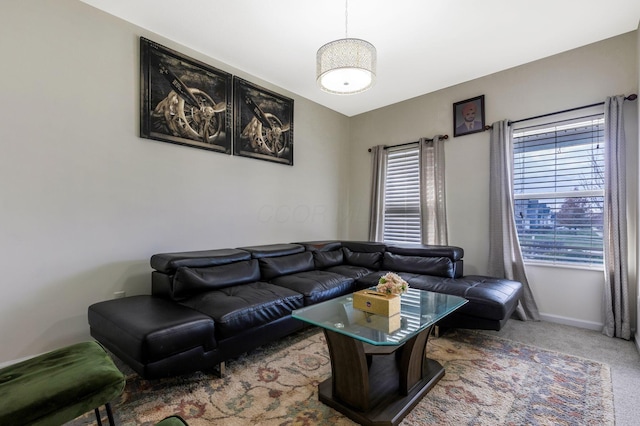 living room featuring a wealth of natural light and carpet floors