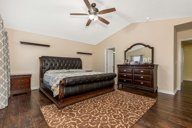 bedroom featuring dark hardwood / wood-style floors, vaulted ceiling, and ceiling fan