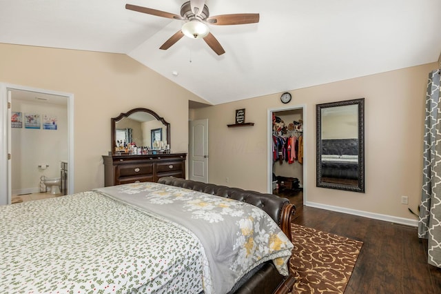 bedroom featuring ceiling fan, a spacious closet, dark hardwood / wood-style flooring, ensuite bathroom, and lofted ceiling