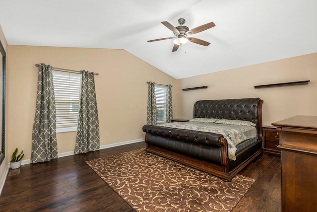 bedroom featuring multiple windows, dark hardwood / wood-style flooring, ceiling fan, and lofted ceiling