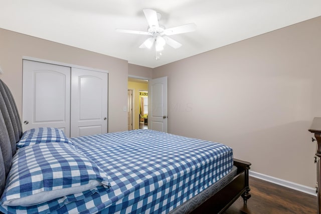 bedroom featuring dark hardwood / wood-style flooring, a closet, and ceiling fan