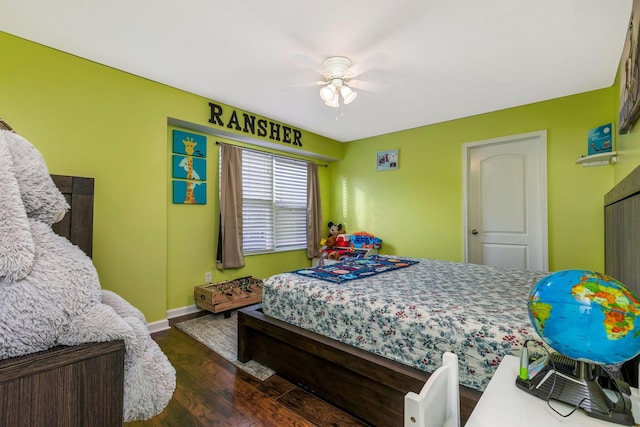 bedroom featuring ceiling fan and dark hardwood / wood-style floors