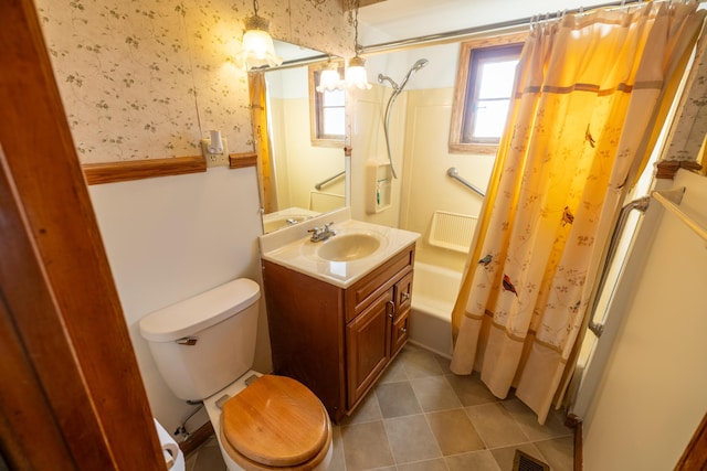 full bathroom with tile patterned flooring, shower / bath combination with curtain, toilet, and vanity