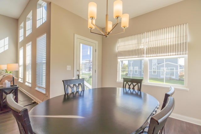 11996 Ficus Field Way, Plain City, OH 43064 - dining room featuring dark wood-style floors and a chandelier