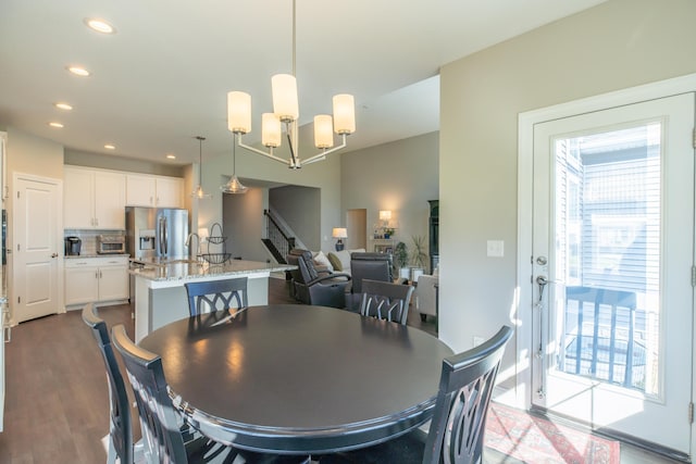 11996 Ficus Field Way, Plain City, OH 43064 - dining room featuring dark wood finished floors, recessed lighting, stairway, and a chandelier