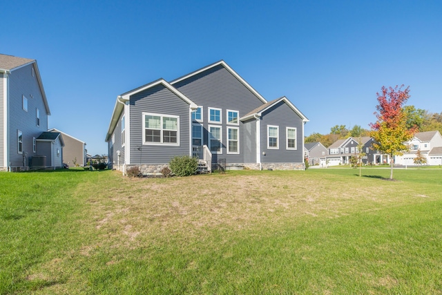 11996 Ficus Field Way, Plain City, OH 43064 - back of house with a lawn