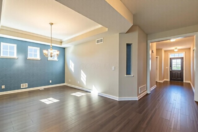 11996 Ficus Field Way, Plain City, OH 43064 - foyer with dark wood-style flooring, a chandelier, and a raised ceiling