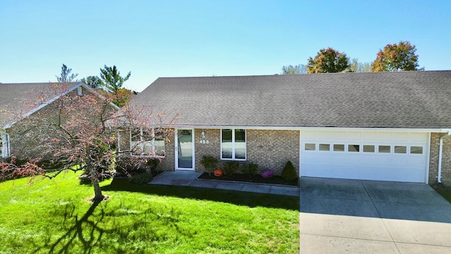 view of front of house featuring a garage and a front lawn