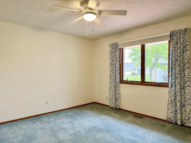 unfurnished room featuring carpet flooring, a textured ceiling, and ceiling fan