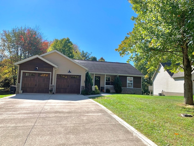 single story home featuring a garage, a front lawn, and cooling unit