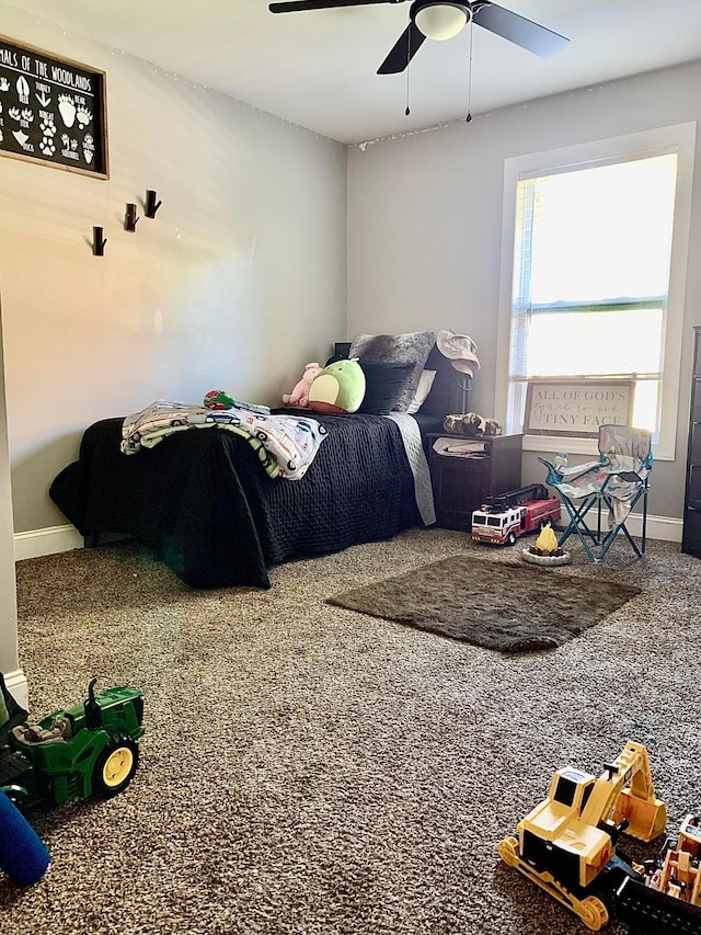 carpeted bedroom with ceiling fan