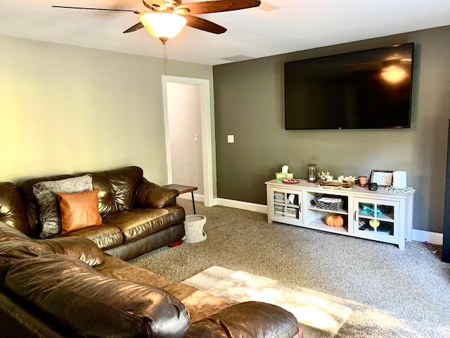 living room with carpet flooring and ceiling fan