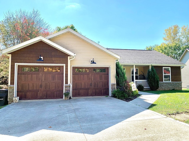 single story home with covered porch and a garage