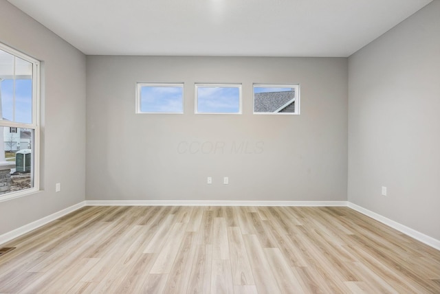 spare room featuring light wood-type flooring