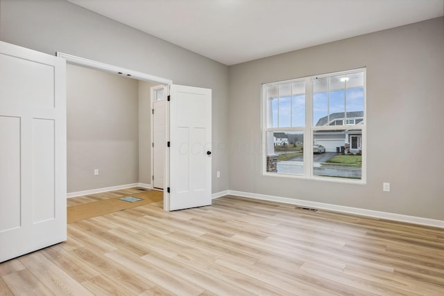 unfurnished bedroom featuring light hardwood / wood-style flooring