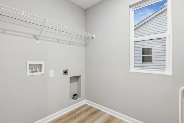 laundry room with washer hookup, light hardwood / wood-style floors, and hookup for an electric dryer