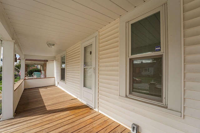 wooden terrace with a porch