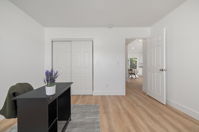 office with light hardwood / wood-style flooring