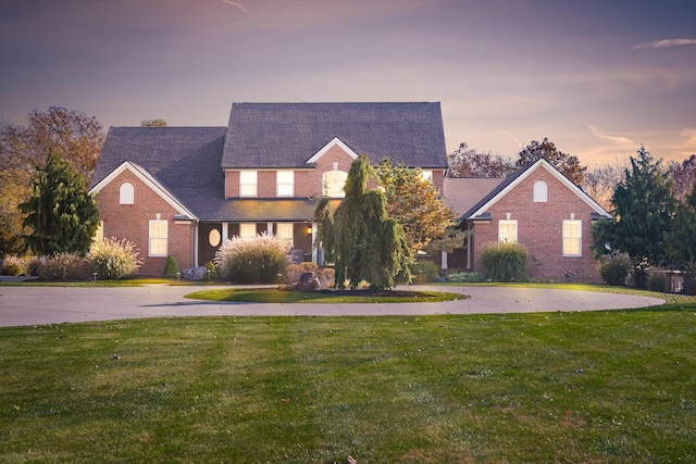 10492 Allen Rd, Pickerington, OH 43147 - traditional-style house featuring curved driveway, a front yard, and brick siding