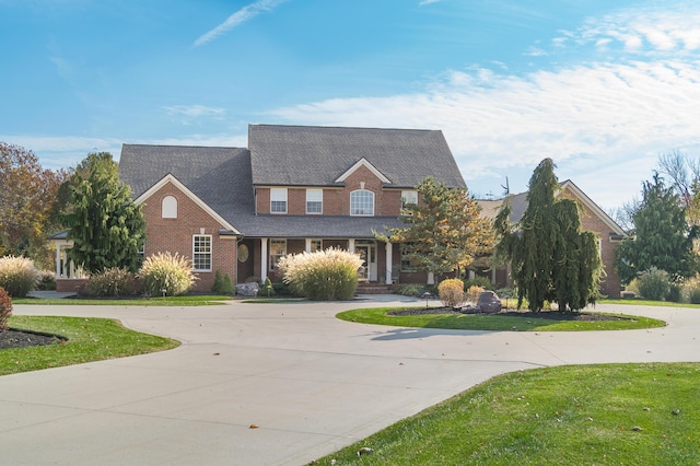 10492 Allen Rd, Pickerington, OH 43147 - view of front of property with curved driveway, a front lawn, and brick siding