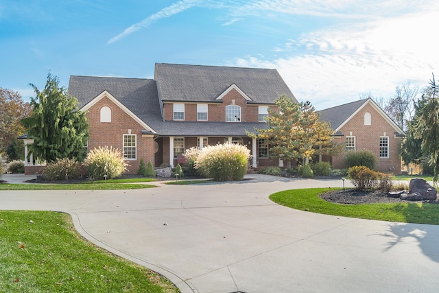 10492 Allen Rd, Pickerington, OH 43147 - view of front facade with brick siding, curved driveway, and roof with shingles