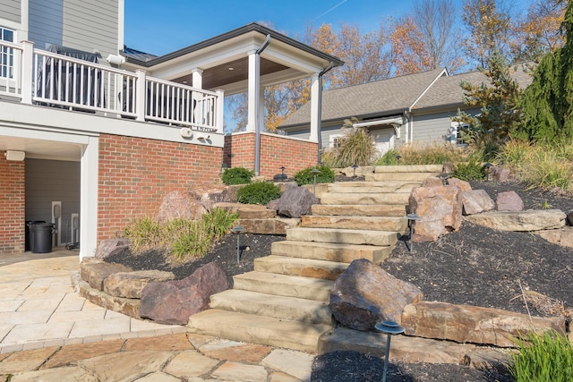 10492 Allen Rd, Pickerington, OH 43147 - view of exterior entry with brick siding and a balcony