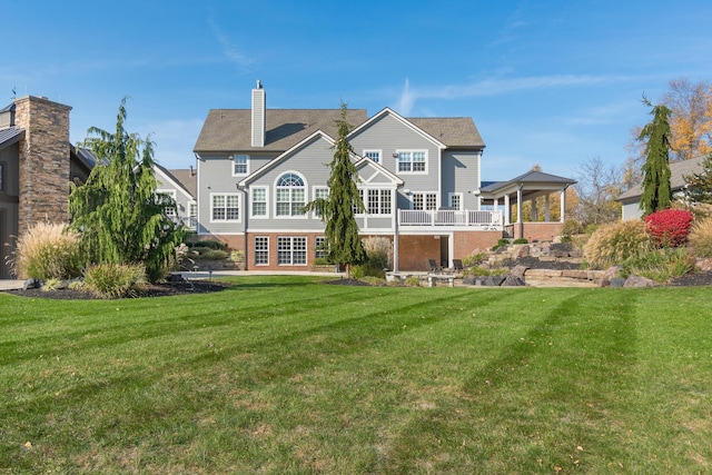 10492 Allen Rd, Pickerington, OH 43147 - rear view of property with a lawn, a chimney, and brick siding