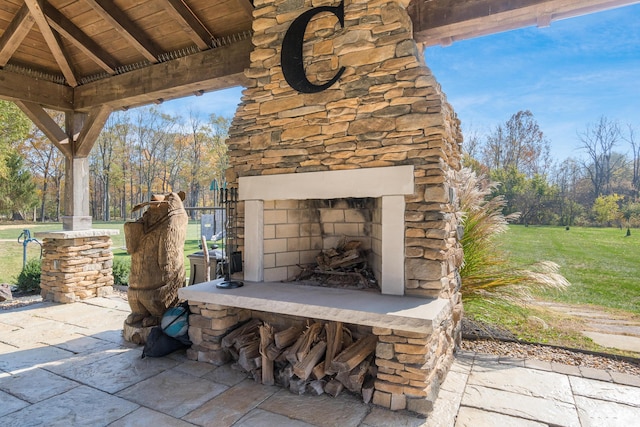 view of patio / terrace with an outdoor stone fireplace