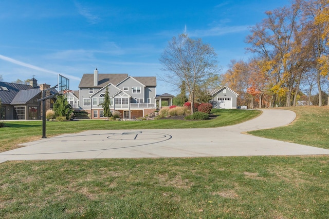 view of sport court with a lawn